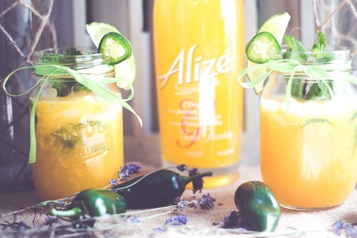 This Jalapeno Mango Mojioto is a sweet yet spicy cocktail guaranteed to be the hit at your next get together. #alizeincolor 